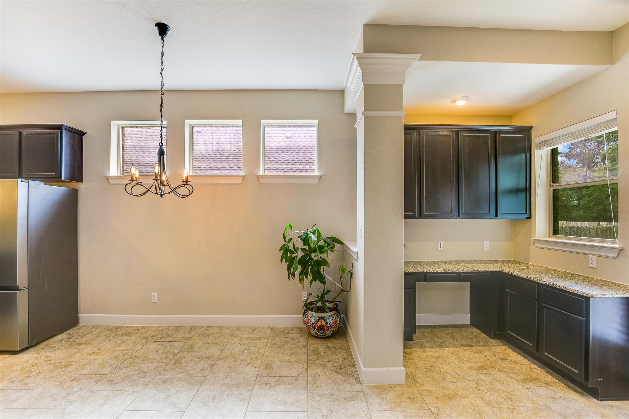 203 Gaspar Bend Cedar Park, TX 78613 - Photo 9 of 20 a view of a kitchen with a sink and dishwasher refrigerator