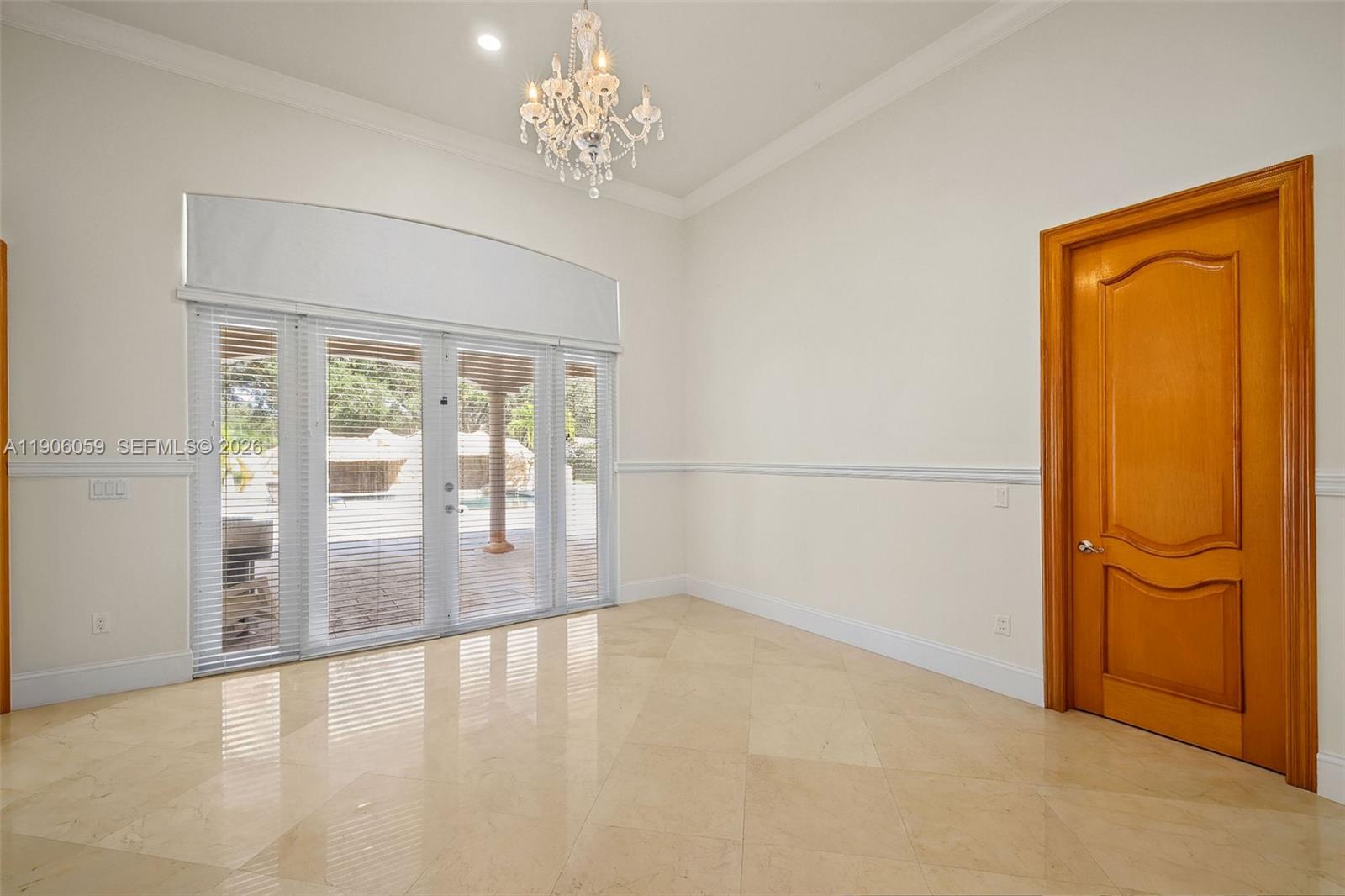 12175 Southwest 80th Street Miami, FL 33183 - Photo 13 of 56 wooden floor in an empty room with a window