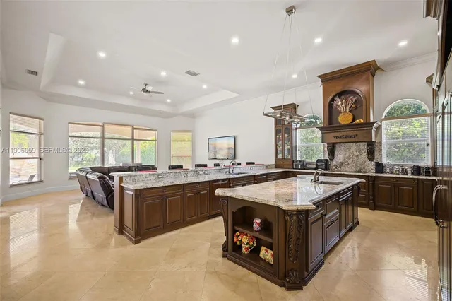 a living room with lots of furniture and kitchen