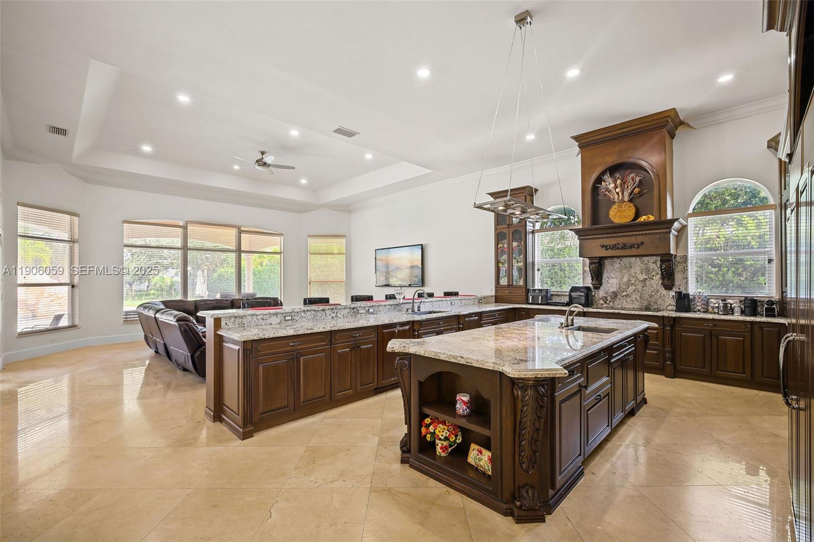 12175 Southwest 80th Street Miami, FL 33183 - Photo 15 of 61 a large kitchen with stainless steel appliances granite countertop a stove and a sink