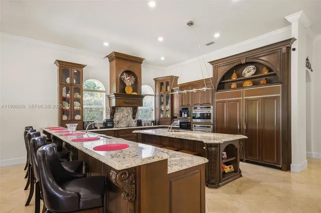 a living room with furniture and large windows