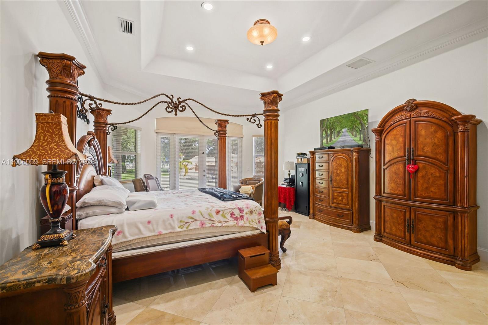 12175 Southwest 80th Street Miami, FL 33183 - Photo 17 of 56 a bedroom with furniture and a window