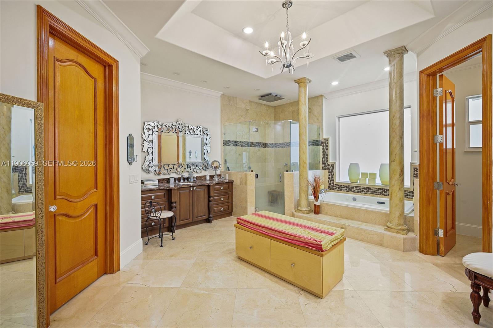 12175 Southwest 80th Street Miami, FL 33183 - Photo 18 of 56 a spacious bedroom with a bed and glass door
