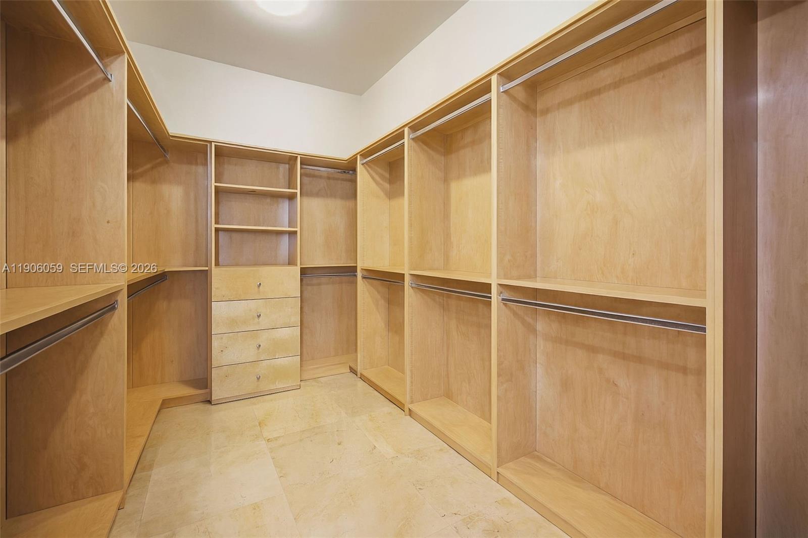 12175 Southwest 80th Street Miami, FL 33183 - Photo 20 of 56 a view of walk in closet with empty racks