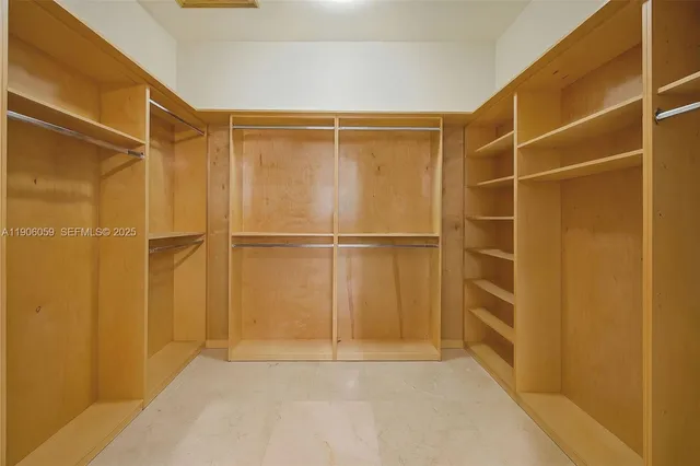 a bathroom with a granite countertop sink mirror and a bathtub