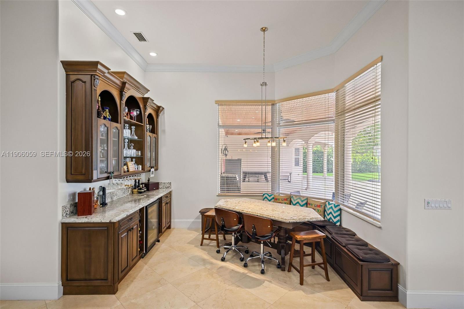 12175 Southwest 80th Street Miami, FL 33183 - Photo 29 of 56 a very nice looking dining room with a large window and furniture