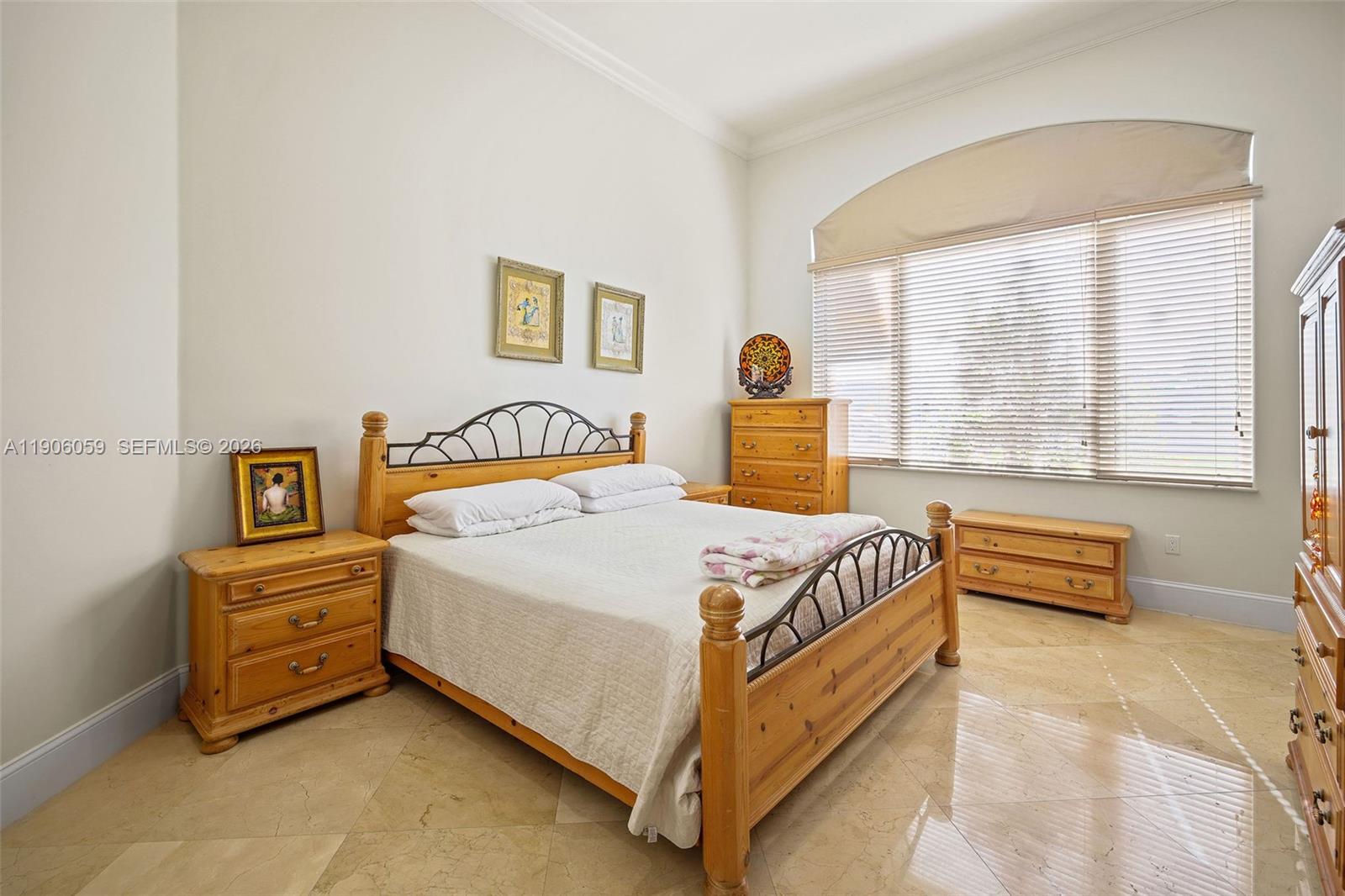 12175 Southwest 80th Street Miami, FL 33183 - Photo 30 of 56 a bedroom with a bed and a window