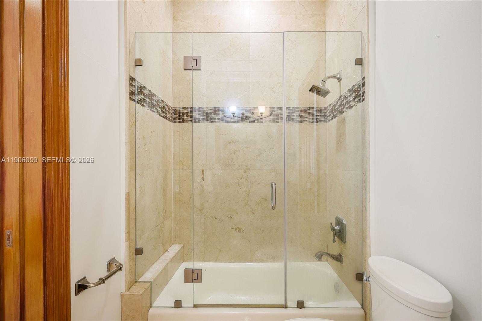 12175 Southwest 80th Street Miami, FL 33183 - Photo 32 of 56 a bathroom with a shower and bathtub