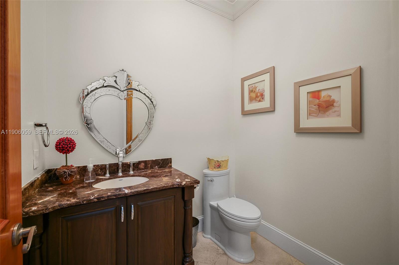 12175 Southwest 80th Street Miami, FL 33183 - Photo 34 of 56 a bathroom with a granite countertop sink mirror and toilet