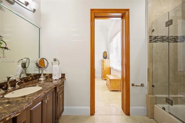 a view of a house with pool and chairs