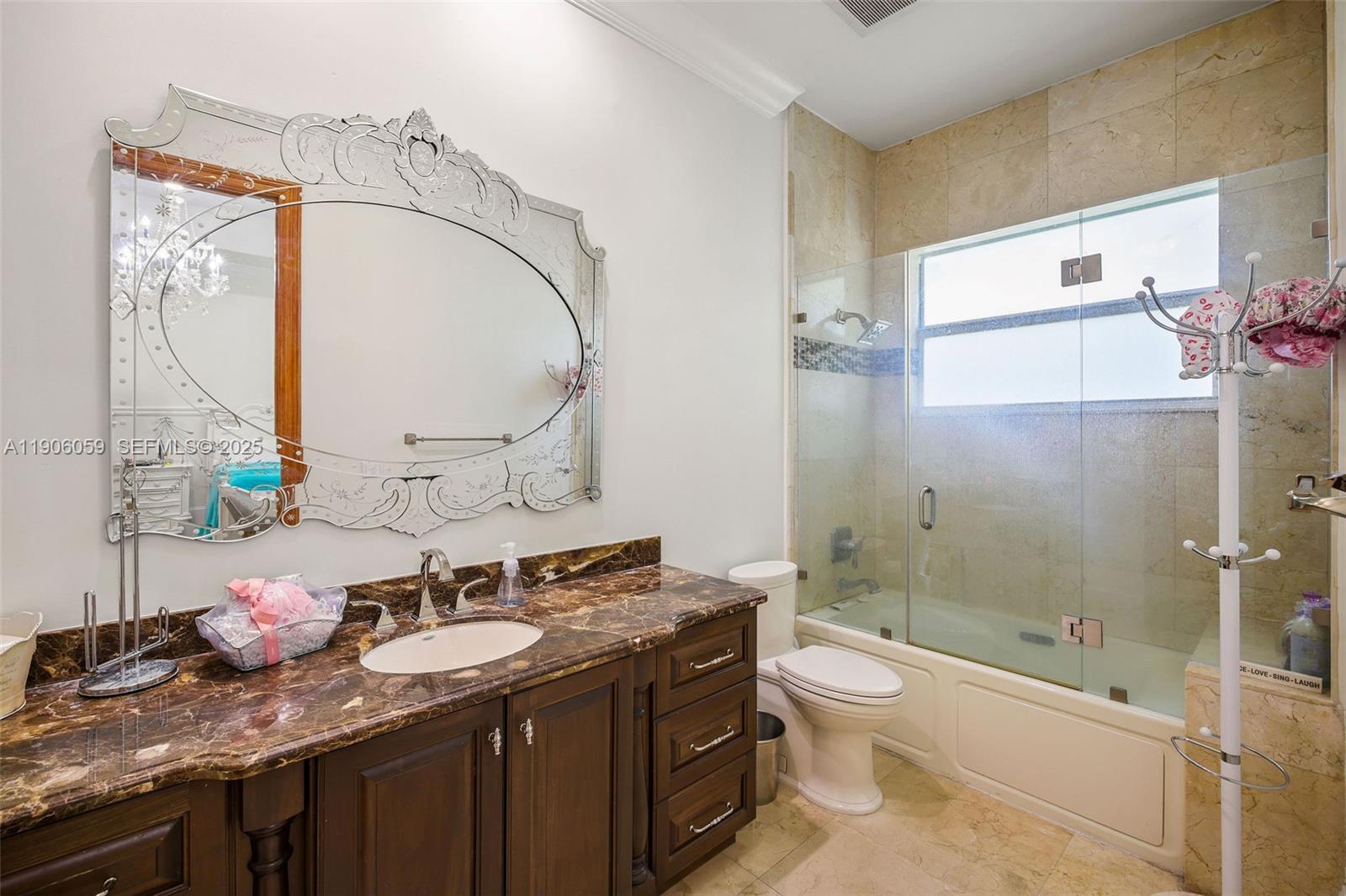 12175 Southwest 80th Street Miami, FL 33183 - Photo 36 of 61 a bathroom with a granite countertop sink mirror and a bathtub