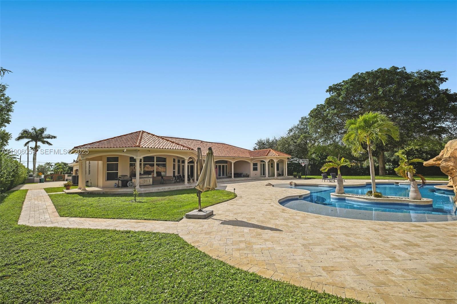 12175 Southwest 80th Street Miami, FL 33183 - Photo 40 of 61 a view of a house with a yard