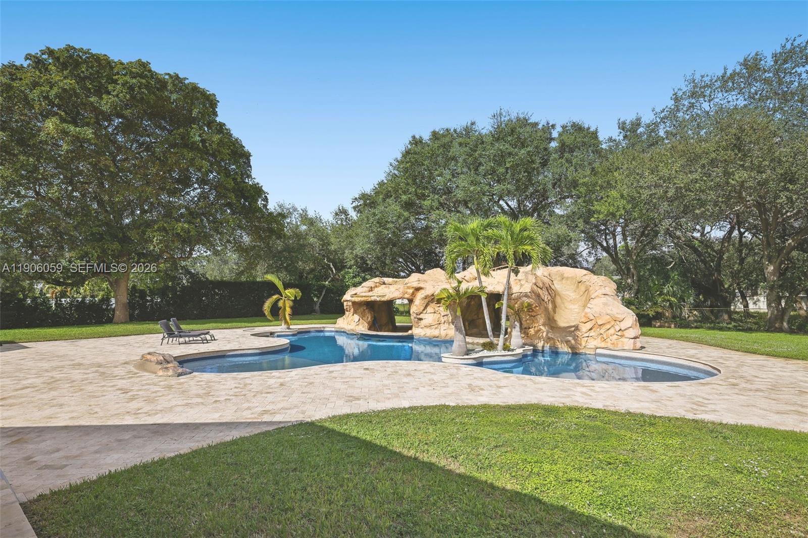 12175 Southwest 80th Street Miami, FL 33183 - Photo 44 of 56 a view of outdoor space with playground and green space