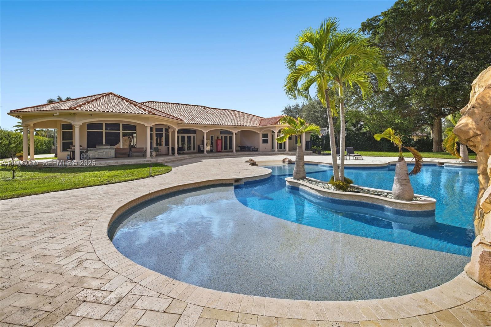 12175 Southwest 80th Street Miami, FL 33183 - Photo 46 of 56 a view of a house with swimming pool