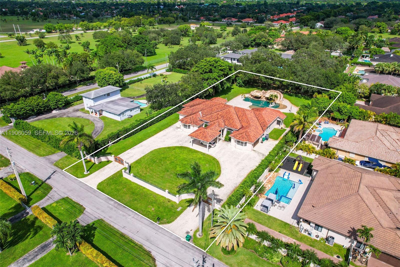 12175 Southwest 80th Street Miami, FL 33183 - Photo 54 of 56 an aerial view of a swimming pool a yard and outdoor seating