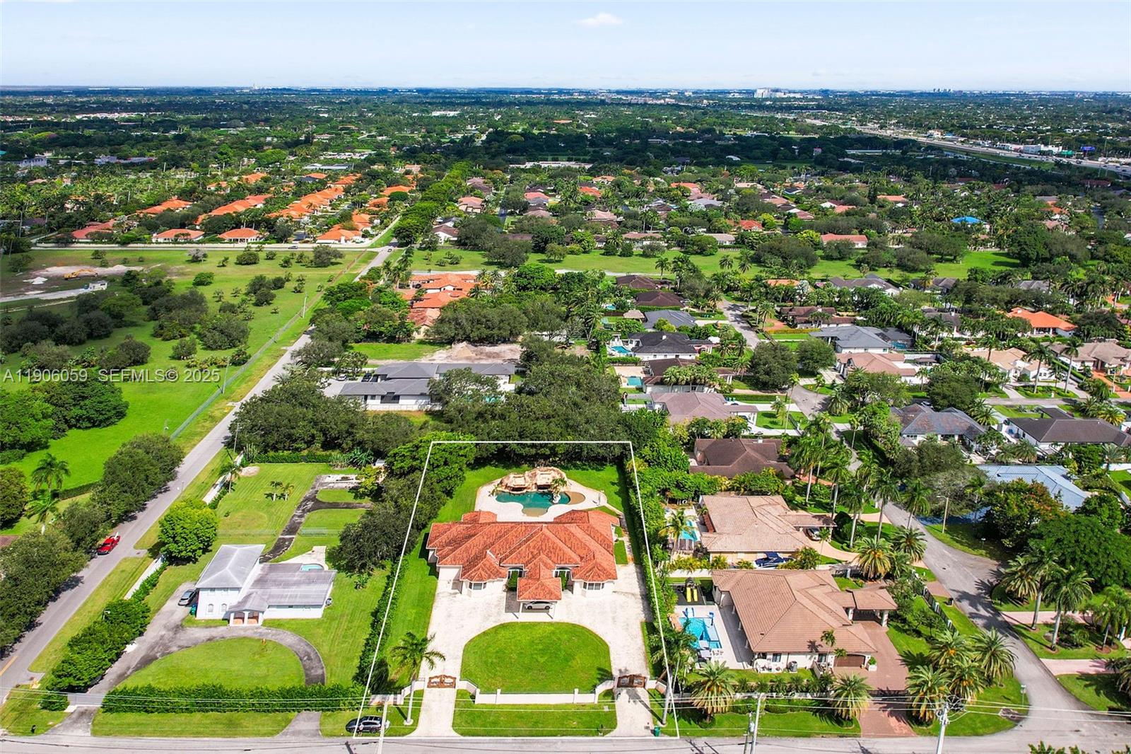 12175 Southwest 80th Street Miami, FL 33183 - Photo 57 of 61 an aerial view of residential houses with outdoor space and trees