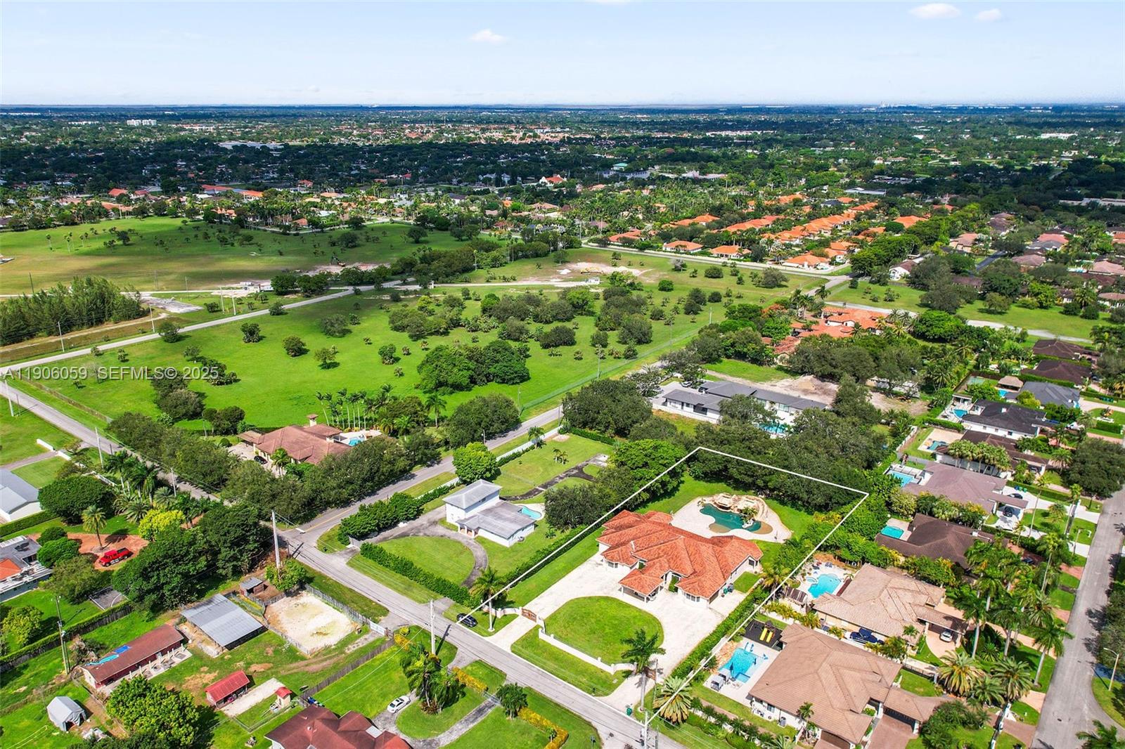 12175 Southwest 80th Street Miami, FL 33183 - Photo 58 of 61 an aerial view of residential houses with outdoor space and trees
