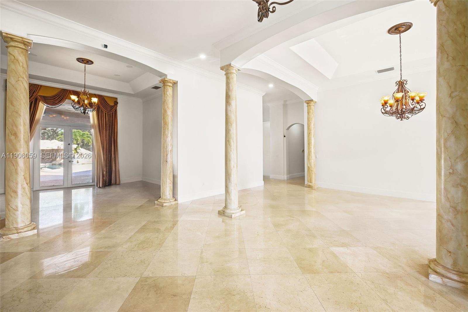 12175 Southwest 80th Street Miami, FL 33183 - Photo 7 of 56 a view of a hallway with a chandelier