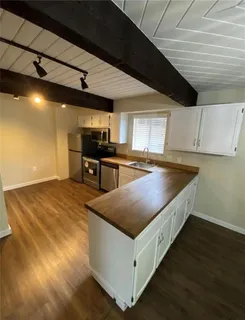 a kitchen with a stove and a microwave