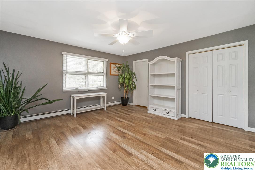 135 Haney Road Kunkletown, PA 18058 - Photo 22 of 53 a view of an empty room with a window and wooden floor