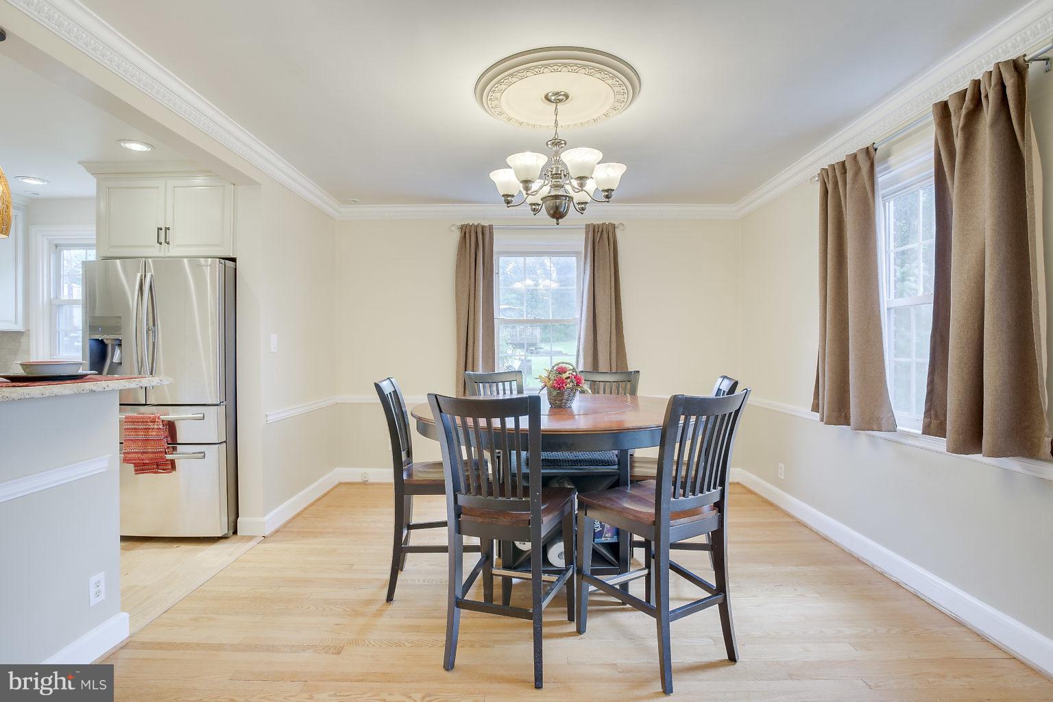 4208 Barrington Road Baltimore, MD 21229 - Photo 8 of 28 a view of a dining room with furniture window and wooden floor