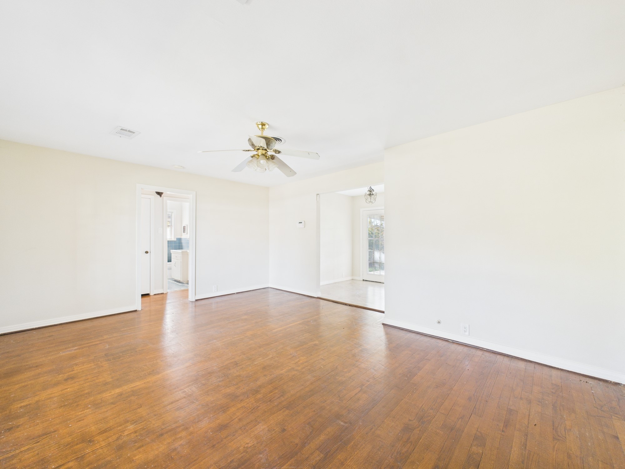 3035 Guese Road Houston, TX 77018 - Photo 4 of 20 a view of an empty room with wooden floor
