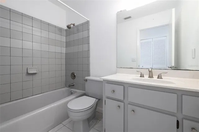 an empty room with entrance and windows