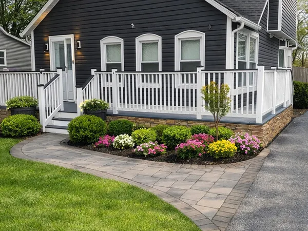 a front view of a house having a garden