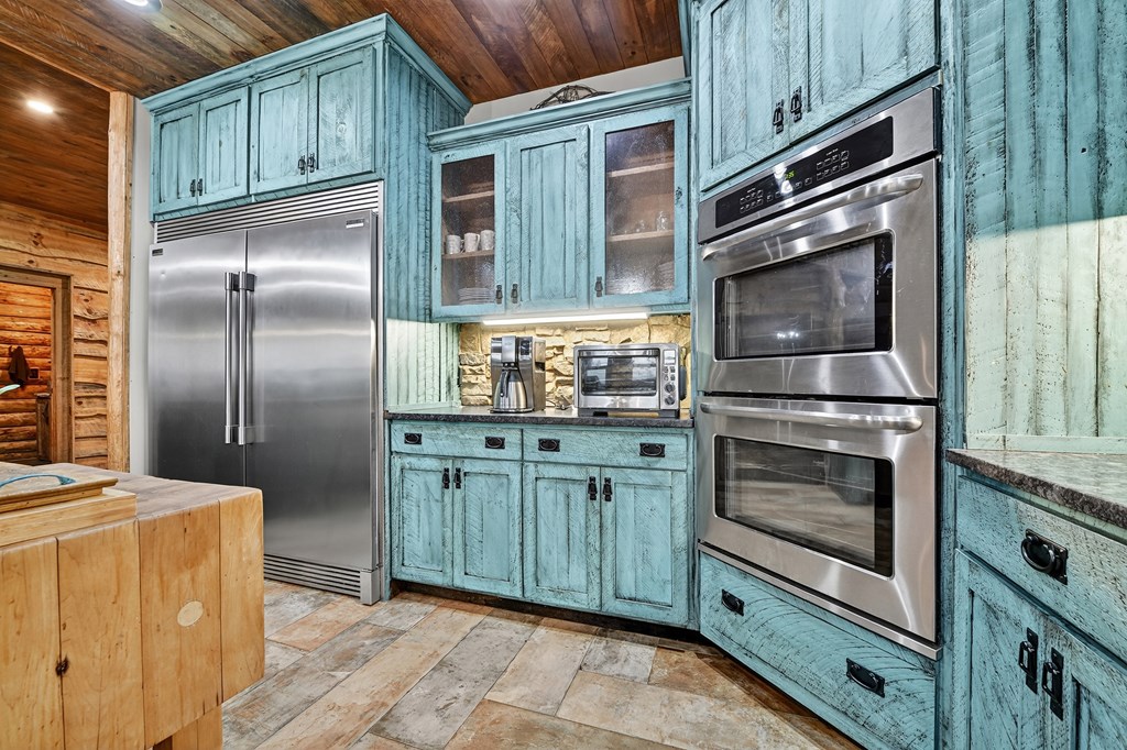 785 Wehunt Road Epworth, GA 30541 - Photo 14 of 73 a kitchen with granite countertop stainless steel appliances and wooden cabinets