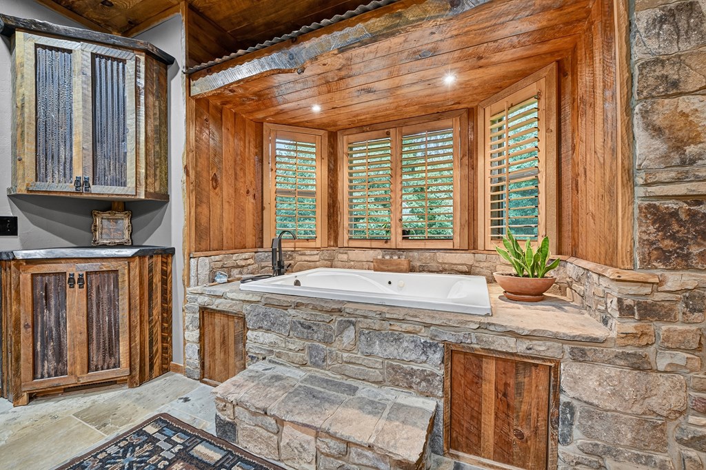 785 Wehunt Road Epworth, GA 30541 - Photo 26 of 73 a bathroom with granite countertop a sink and a window
