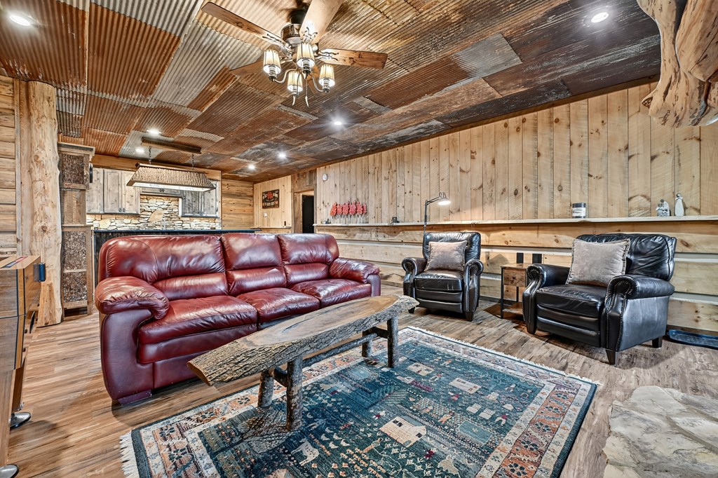 785 Wehunt Road Epworth, GA 30541 - Photo 36 of 73 a couch sitting in a room next to a chandelier