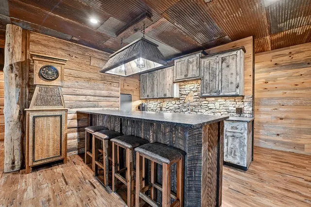 a view of a chairs in backyard of the house