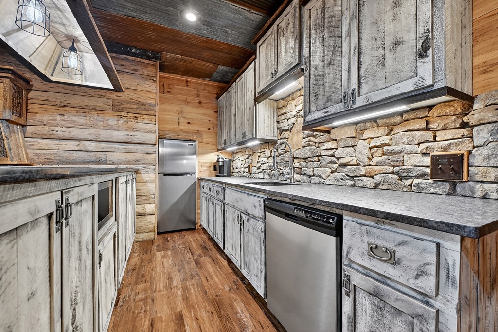 785 Wehunt Road Epworth, GA 30541 - Photo 38 of 73 a kitchen with stainless steel appliances granite countertop a stove and a sink