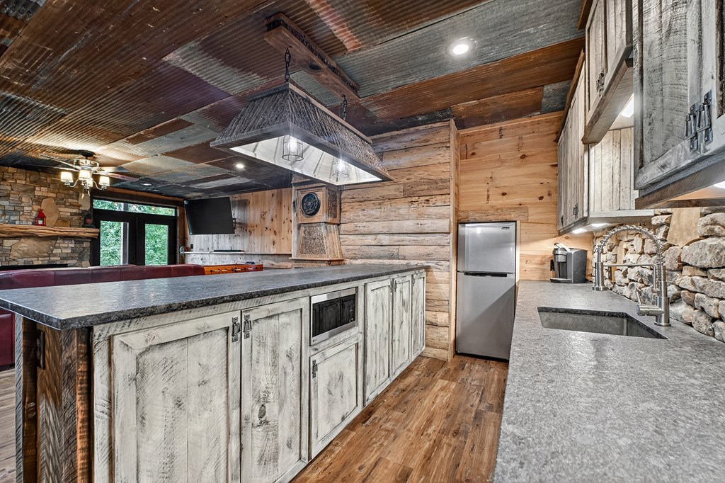 785 Wehunt Road Epworth, GA 30541 - Photo 39 of 73 a kitchen with stainless steel appliances granite countertop a sink and stove