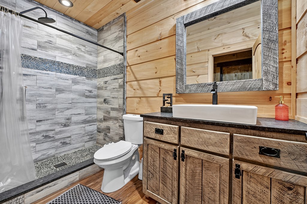 785 Wehunt Road Epworth, GA 30541 - Photo 41 of 73 a bathroom with a sink toilet and shower