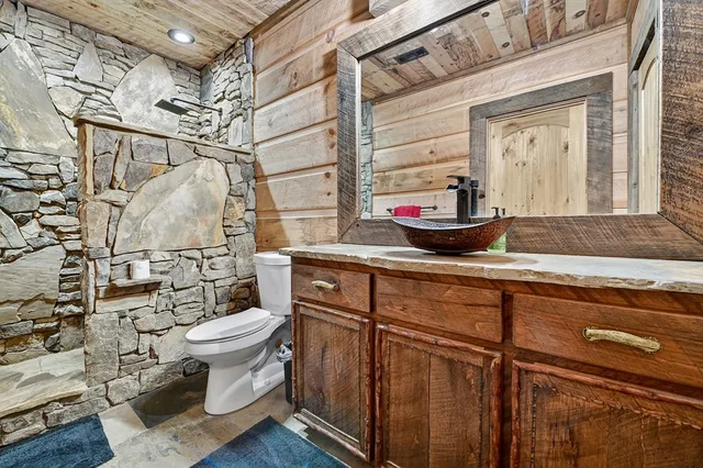 a view of a field of grass and trees