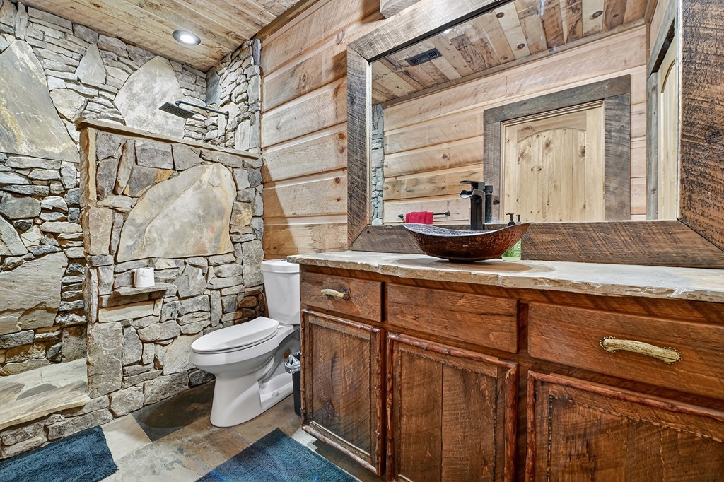 785 Wehunt Road Epworth, GA 30541 - Photo 46 of 73 a bathroom with a granite countertop sink toilet and shower