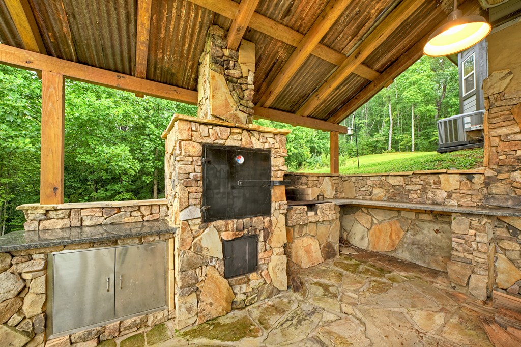 785 Wehunt Road Epworth, GA 30541 - Photo 50 of 73 a view of a patio with table and chairs potted plants with wooden floor and fence