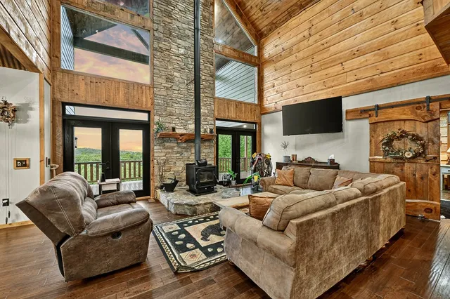 a view of a livingroom with furniture and floor to ceiling windows