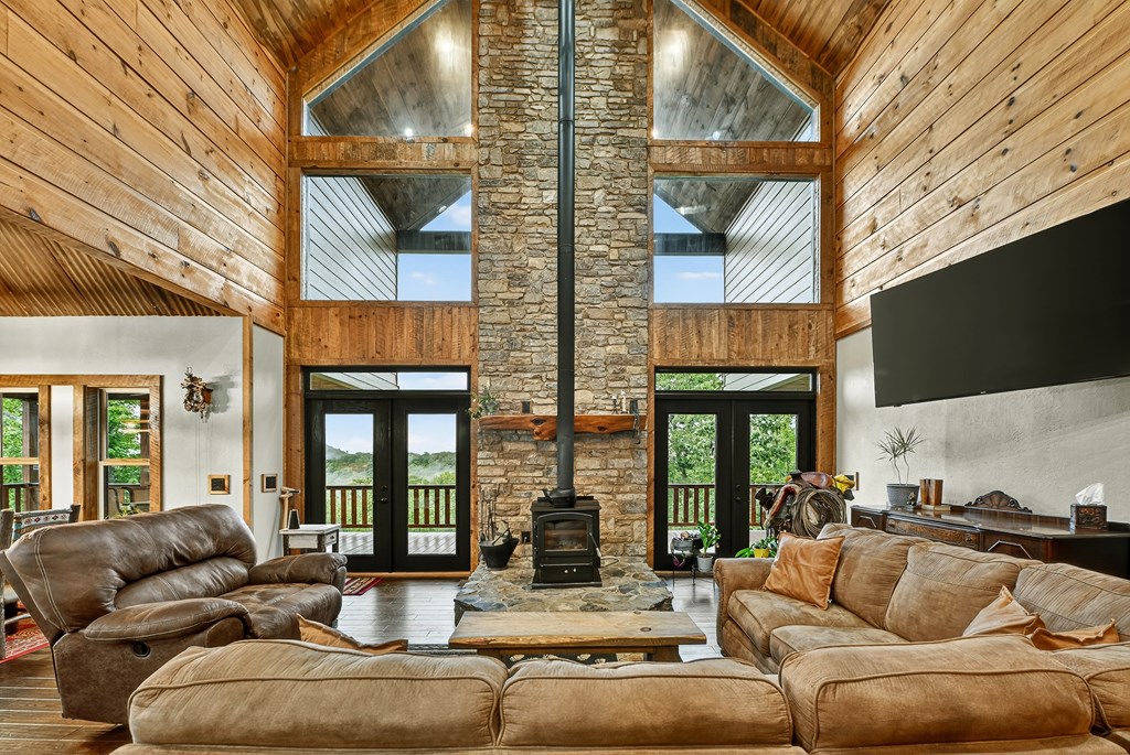 785 Wehunt Road Epworth, GA 30541 - Photo 6 of 73 a view of living room filled with furniture and floor to ceiling window
