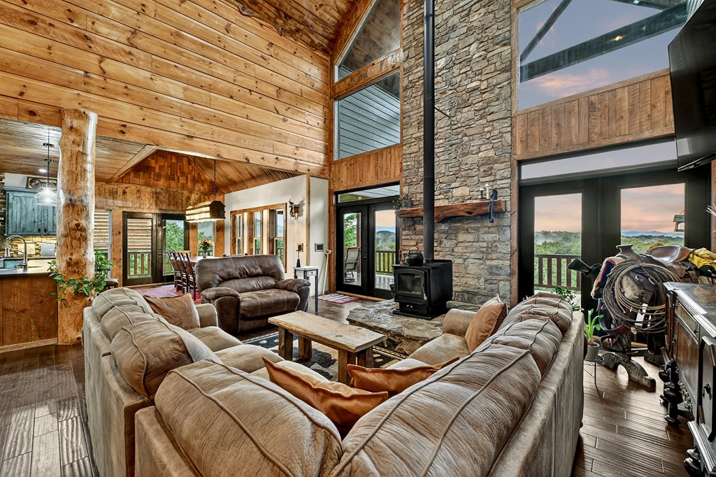 785 Wehunt Road Epworth, GA 30541 - Photo 7 of 73 a view of a livingroom with furniture and floor to ceiling windows