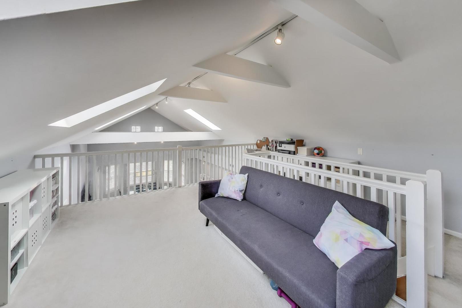 1862 North Halsted Street, Unit 3N Chicago, IL 60614 - Photo 11 of 25 a living room with furniture and a kitchen