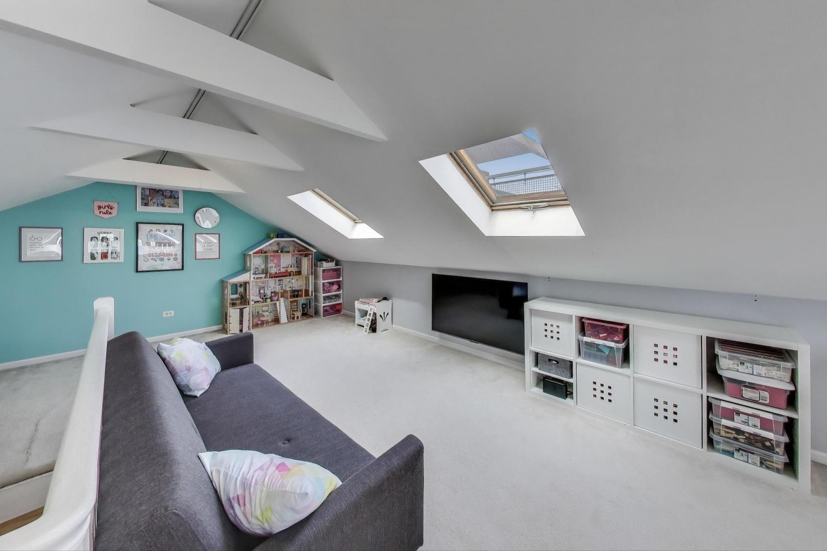 1862 North Halsted Street, Unit 3N Chicago, IL 60614 - Photo 12 of 25 a living room with furniture and a flat screen tv