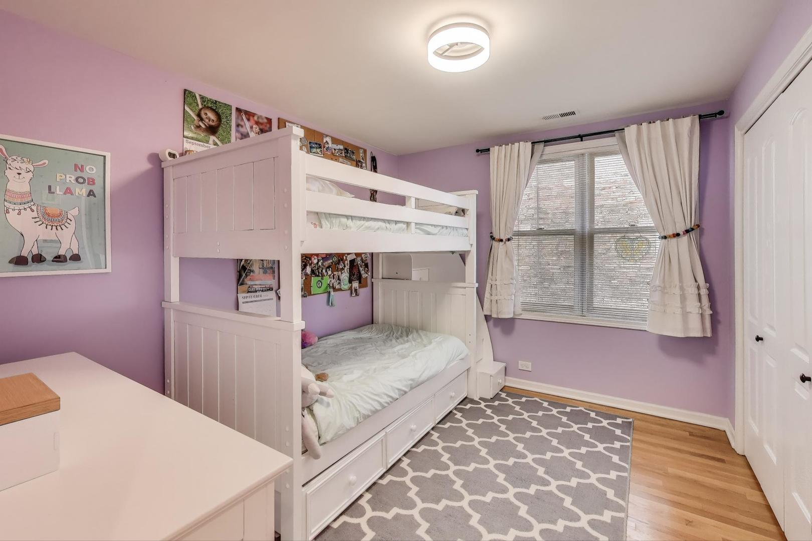 1862 North Halsted Street, Unit 3N Chicago, IL 60614 - Photo 17 of 25 a bedroom with a bed and a window