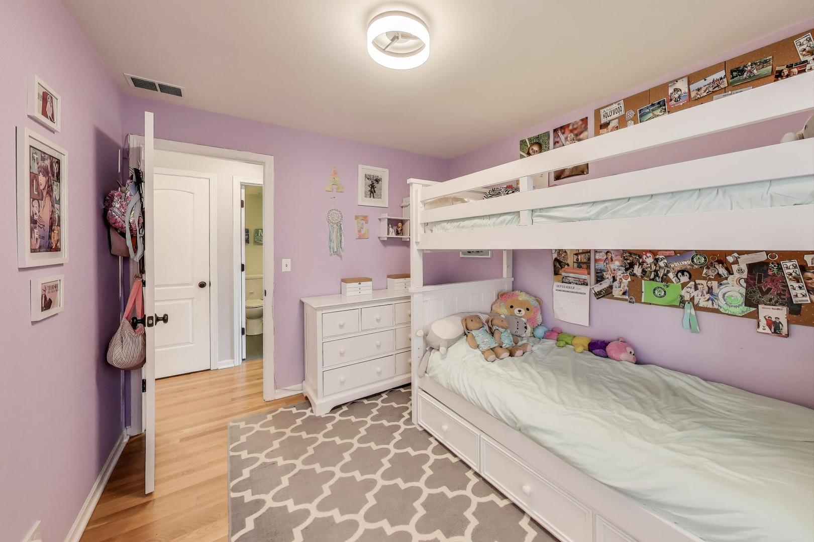1862 North Halsted Street, Unit 3N Chicago, IL 60614 - Photo 18 of 25 a bedroom with furniture and flowers
