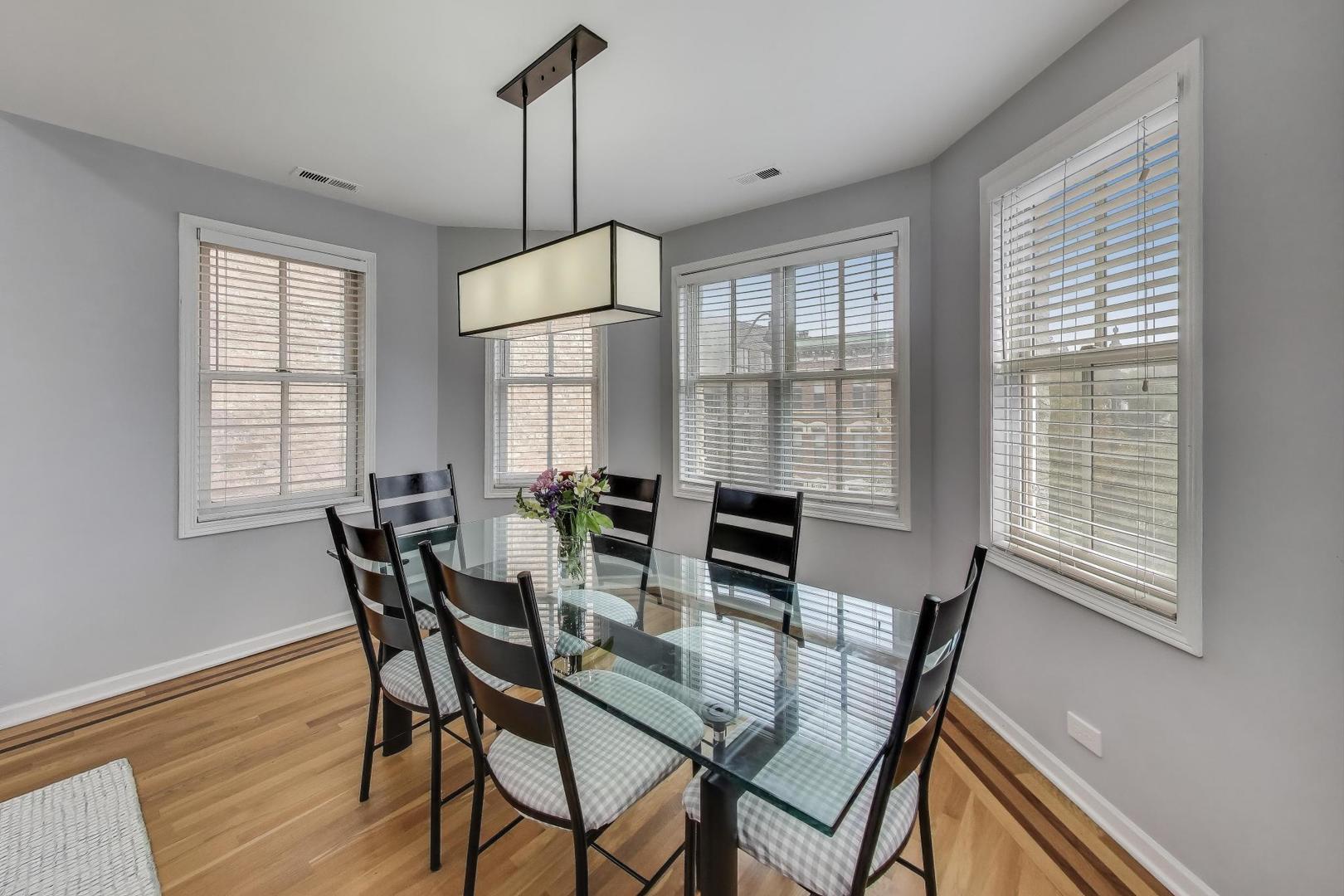 1862 North Halsted Street, Unit 3N Chicago, IL 60614 - Photo 5 of 25 a view of a dining room with furniture window and outside view