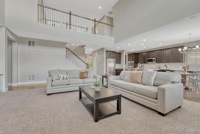 a living room with furniture white walls and white walls