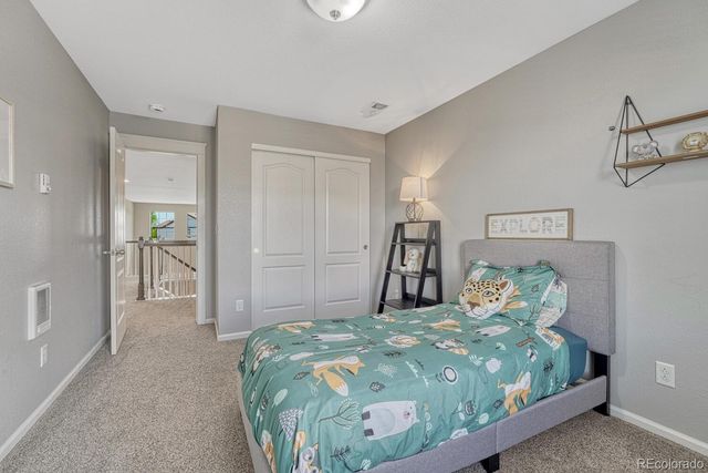 a bedroom with a bed and a table