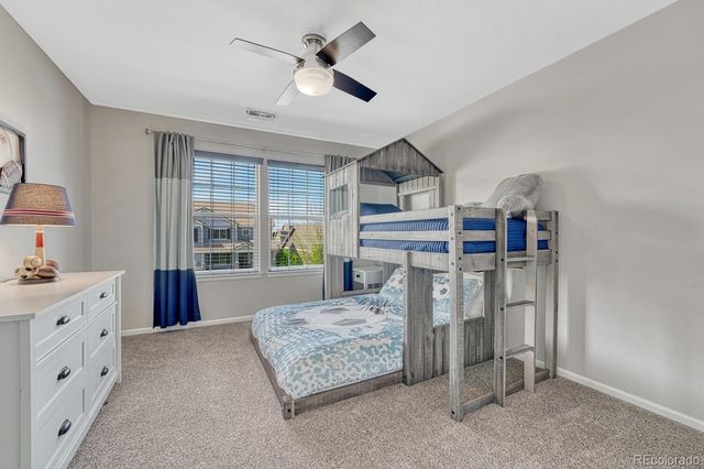 a bedroom with furniture and window