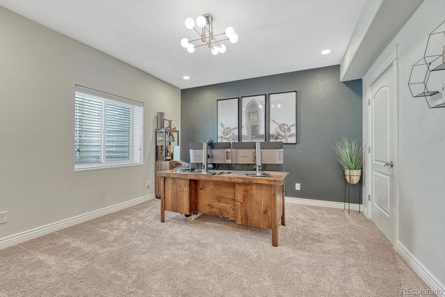 a view of room with windows and cabinet